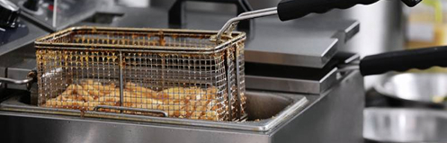 Fryer basket filled with french fries